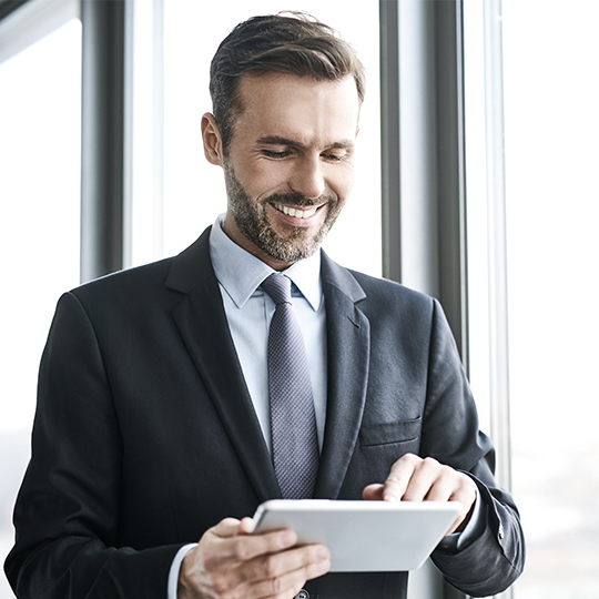 man typing on a tablet