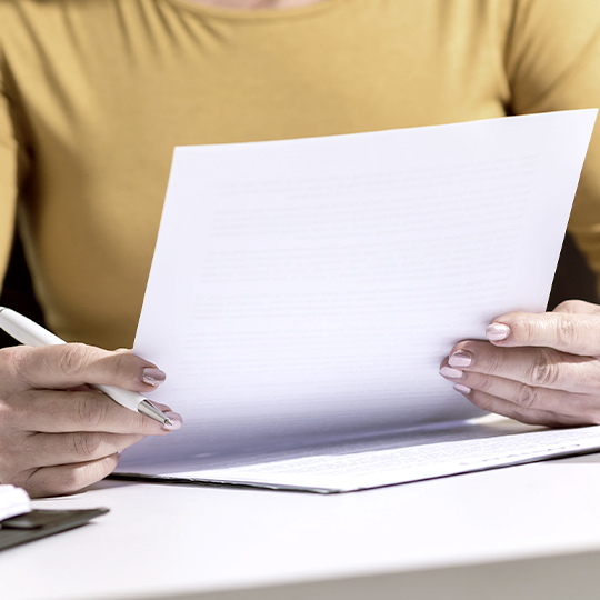 worker looking into a paper