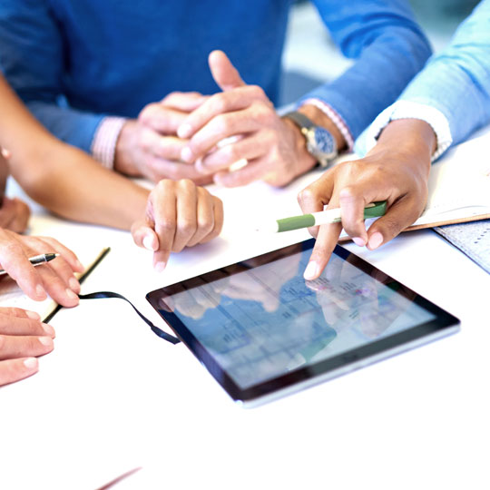 people discussing with a tablet